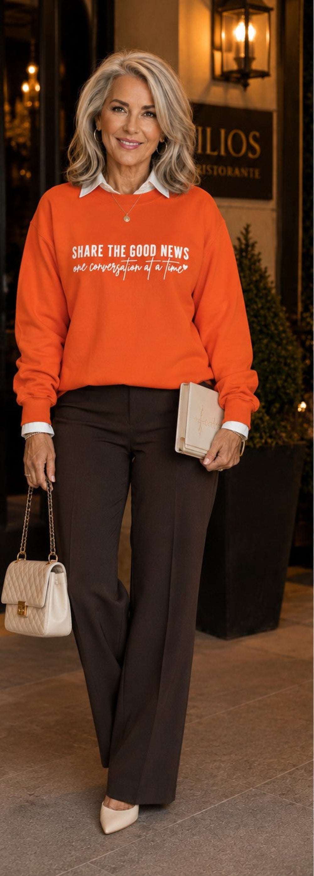 A side-by-side split view of a woman modeling an orange sweatshirt with white text, paired with dark brown pants in an outdoor nighttime setting.